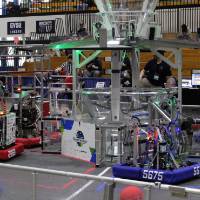 Robots wait on the field for a match to begin
